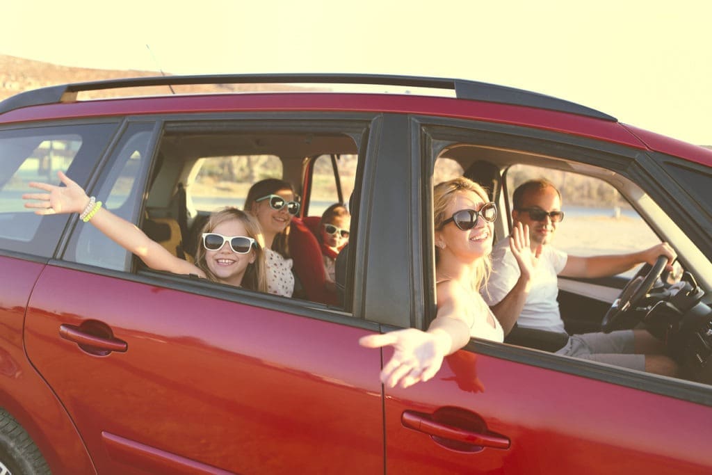 Family enjoy drive in new lease Happy Family in Their Newly Leased Car From Apple Leasing in Austin
